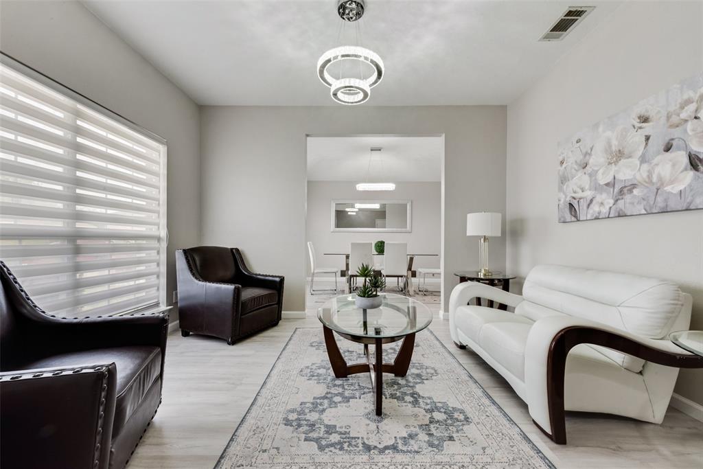 506 Pecos Path Drive Murphy, TX 75094 - Photo 5 of 19 a living room with furniture a rug and white walls
