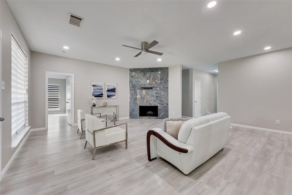 506 Pecos Path Drive Murphy, TX 75094 - Photo 6 of 19 a living room with furniture and a fireplace