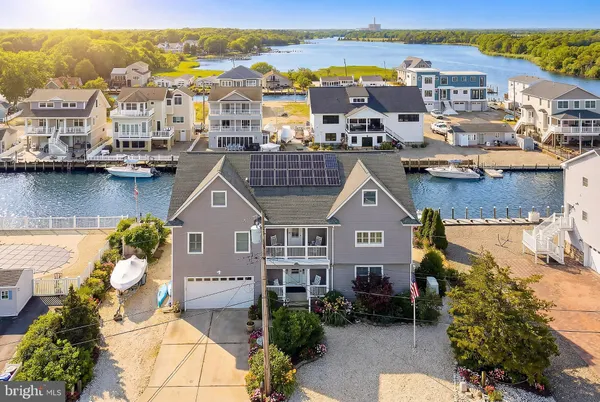 an aerial view of a house with a lake view
