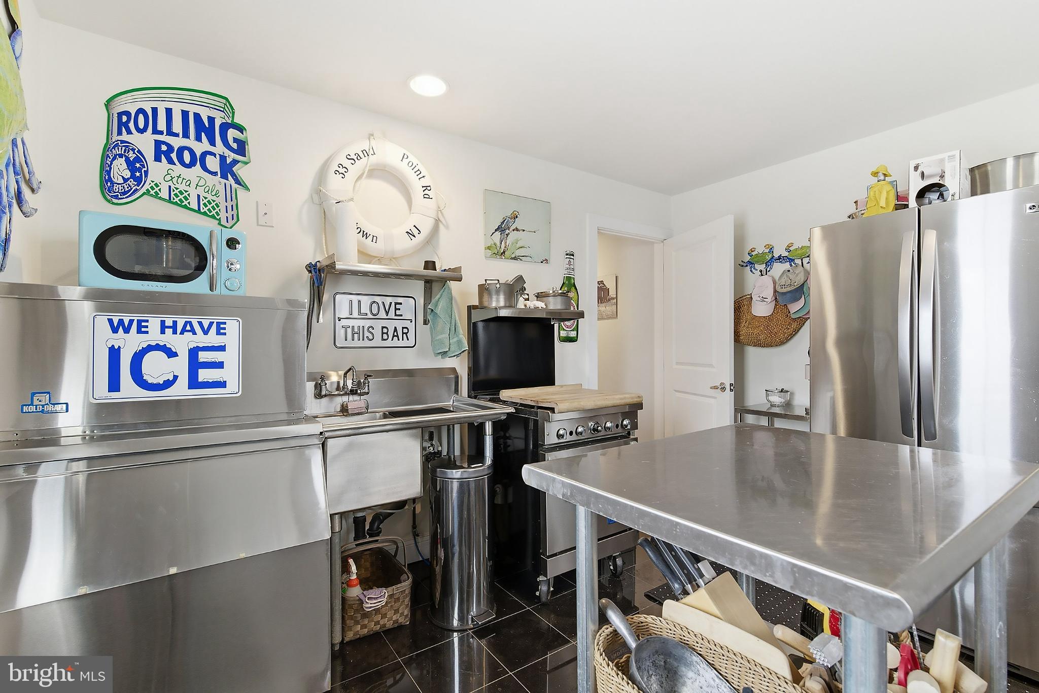 33 Sands Point Road Waretown, NJ 08758 - Photo 15 of 79 a kitchen with stainless steel appliances granite countertop a stove and a refrigerator