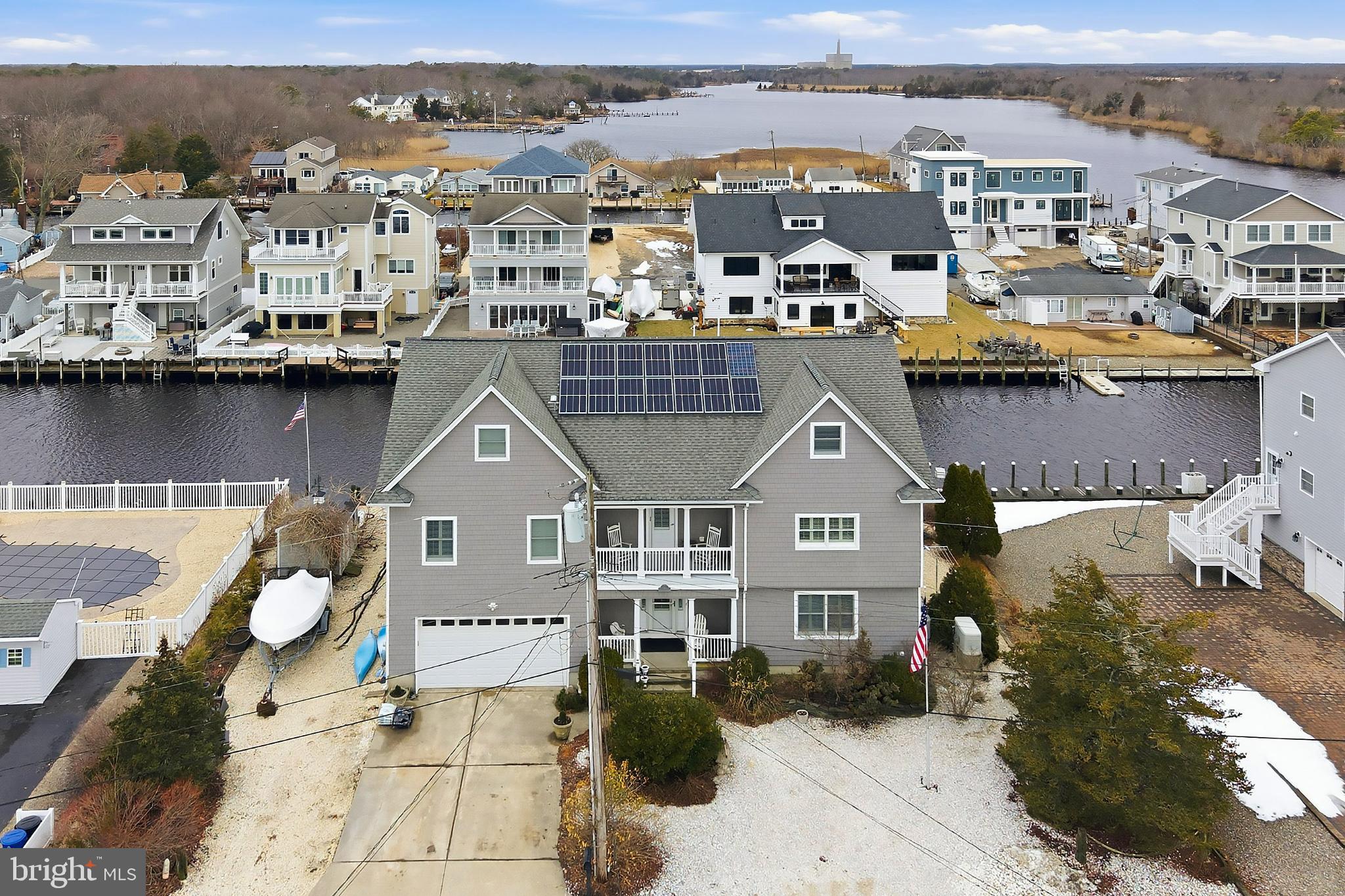 33 Sands Point Road Waretown, NJ 08758 - Photo 2 of 79 an aerial view of a house with a lake view