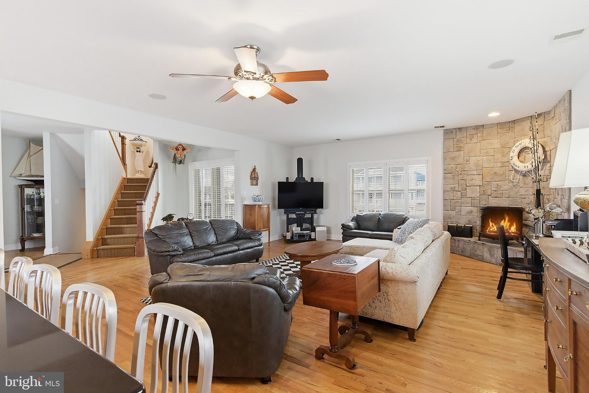 33 Sands Point Road Waretown, NJ 08758 - Photo 22 of 79 a living room with furniture fireplace and a flat screen tv
