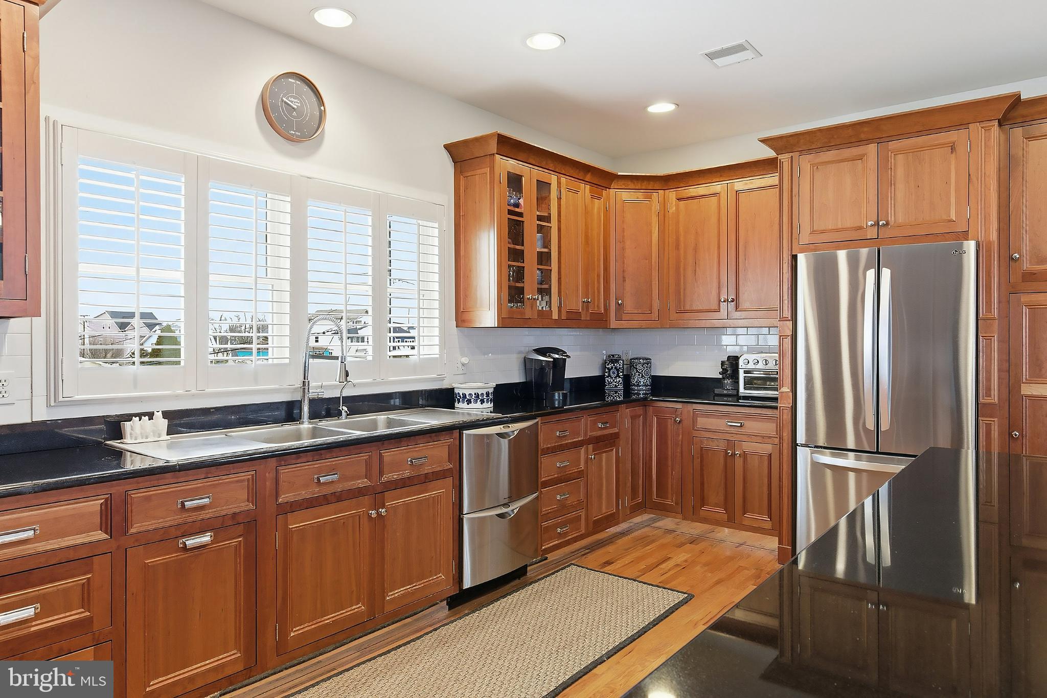 33 Sands Point Road Waretown, NJ 08758 - Photo 25 of 79 a kitchen with stainless steel appliances granite countertop a refrigerator and a sink