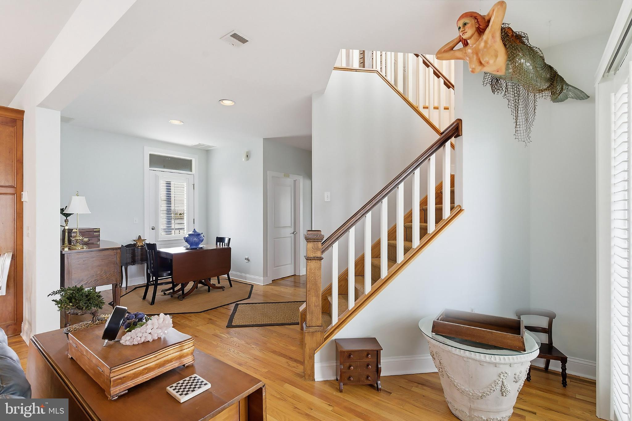 33 Sands Point Road Waretown, NJ 08758 - Photo 30 of 79 a living room with furniture and a dining table with wooden floor