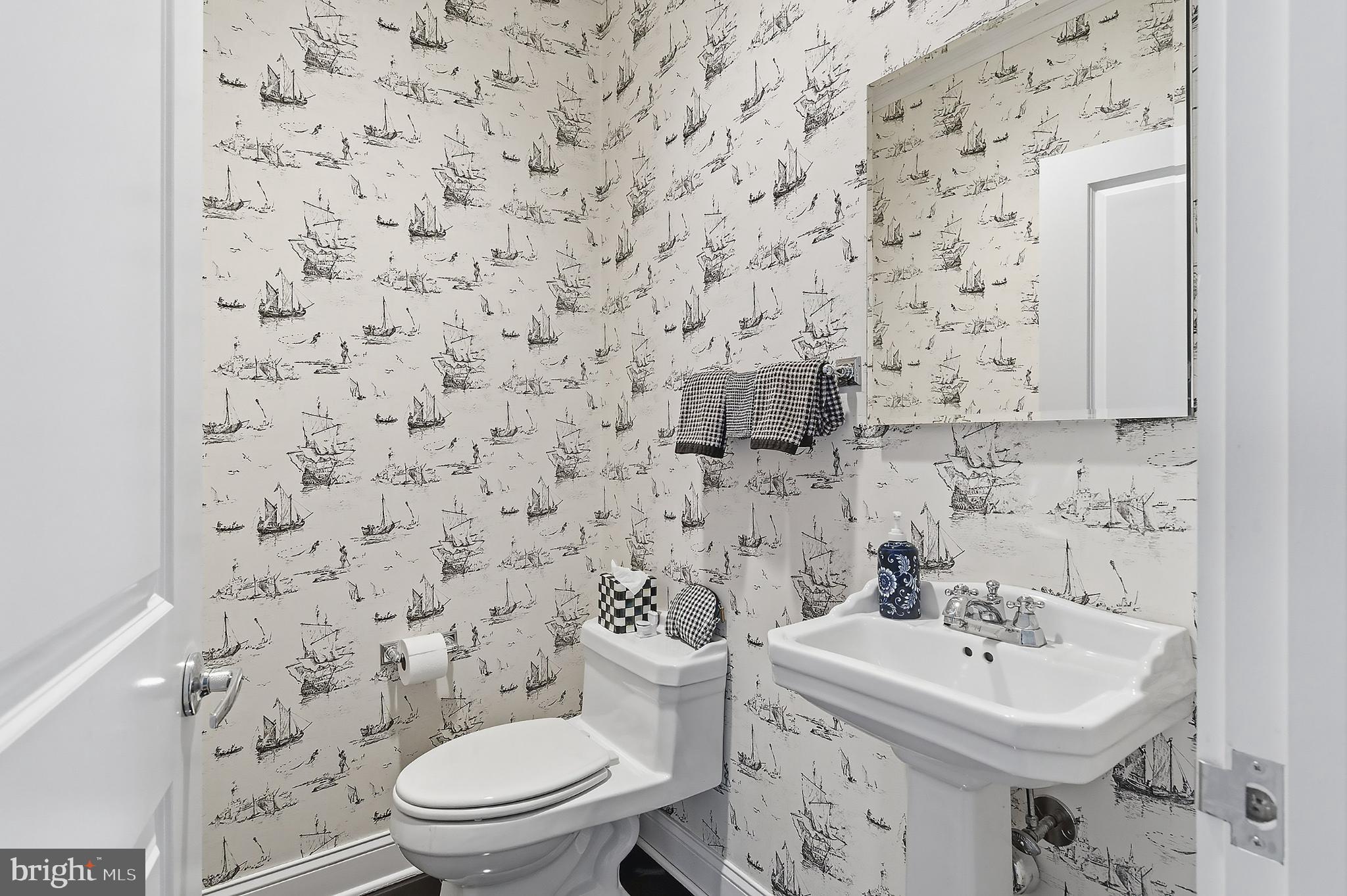 33 Sands Point Road Waretown, NJ 08758 - Photo 32 of 79 a bathroom with a sink a toilet and a mirror