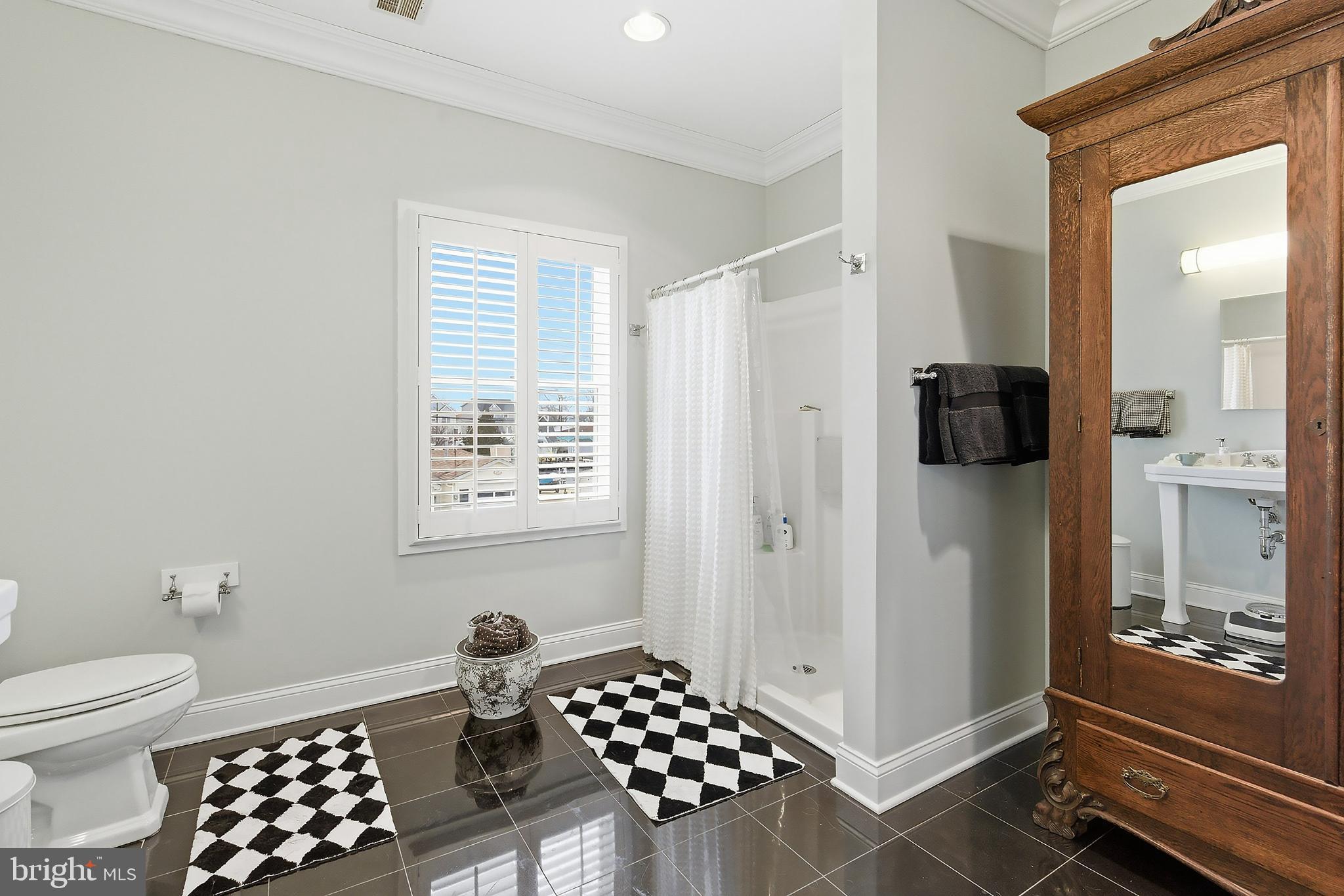 33 Sands Point Road Waretown, NJ 08758 - Photo 40 of 79 a bathroom with a toilet a sink and a window