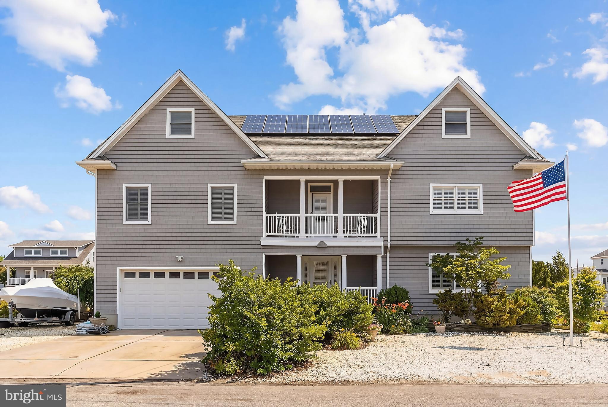 33 Sands Point Road Waretown, NJ 08758 - Photo 4 of 79 a front view of a house with a yard