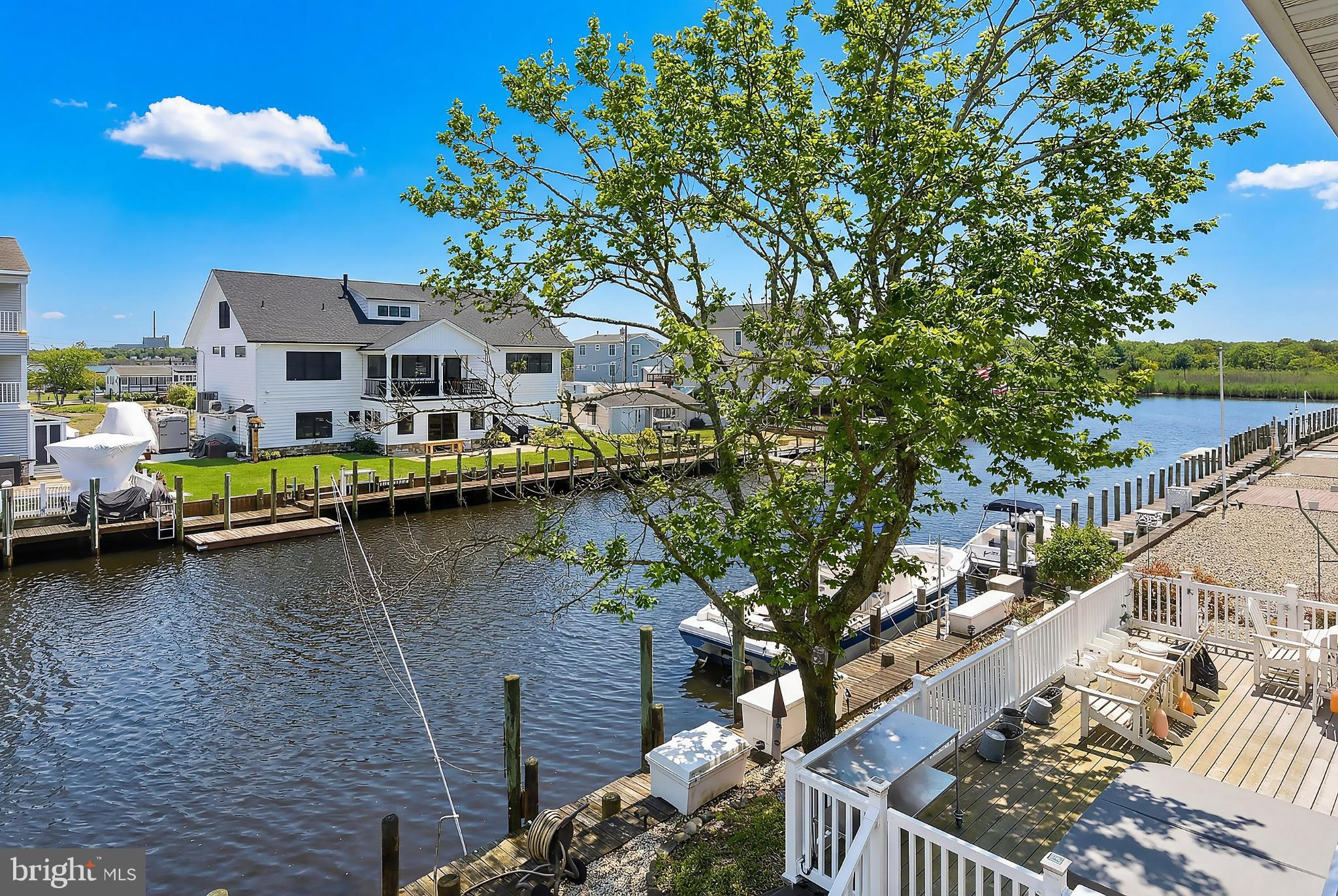 33 Sands Point Road Waretown, NJ 08758 - Photo 55 of 79 a view of house with yard outdoor seating and lake view