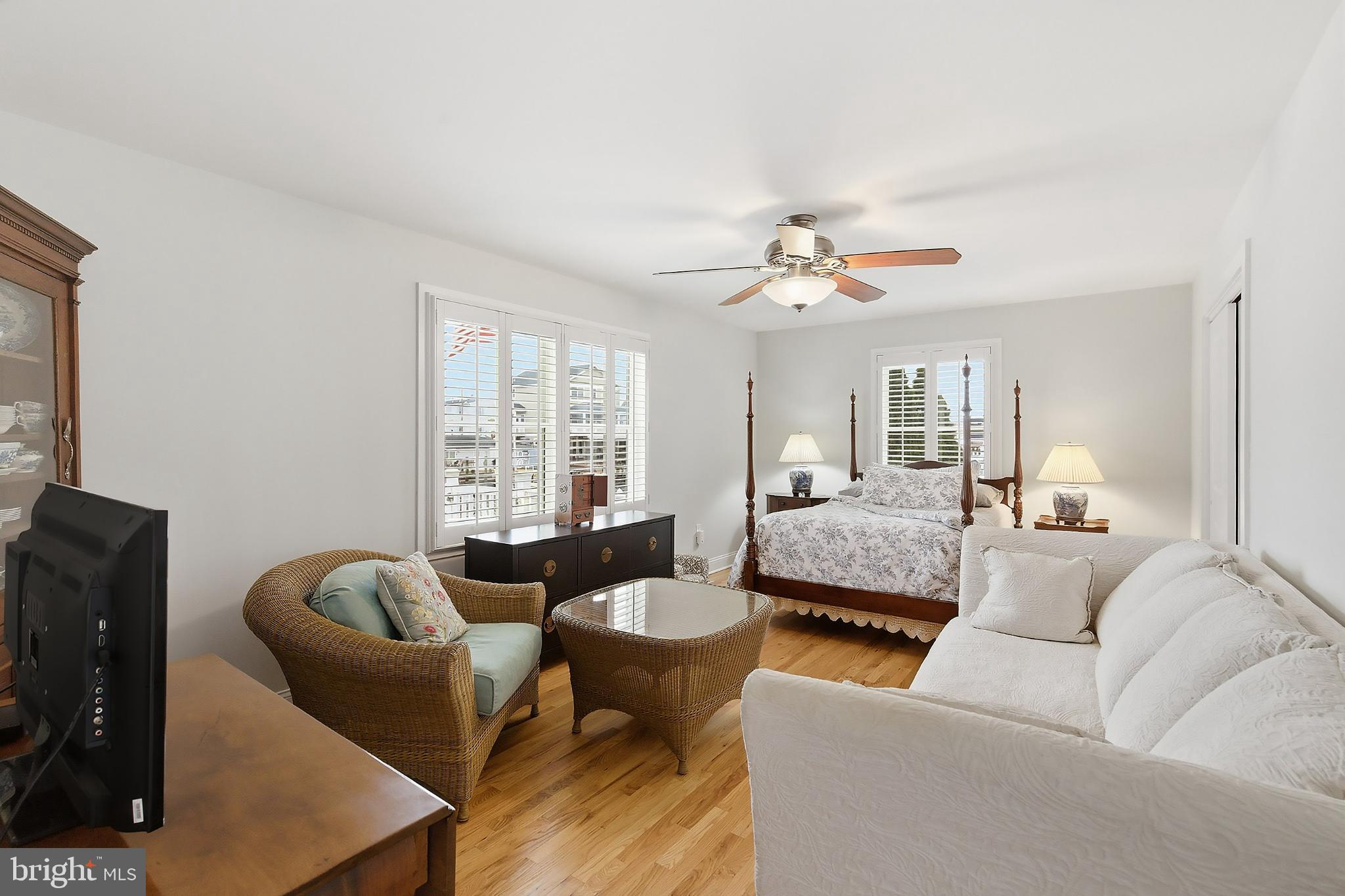 33 Sands Point Road Waretown, NJ 08758 - Photo 10 of 79 a living room with furniture ceiling fan and a window