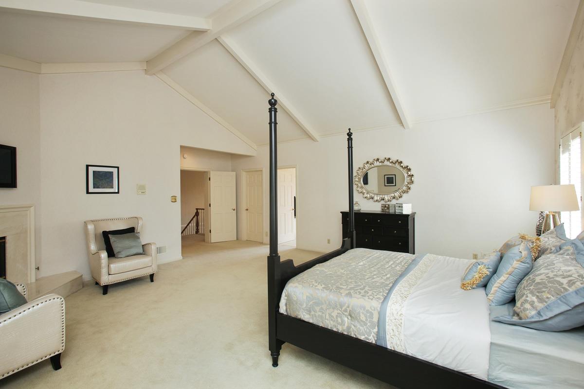 Stonepine Road Hillsborough, CA 94010 - Photo 15 of 25 a bedroom with a bed and a couch