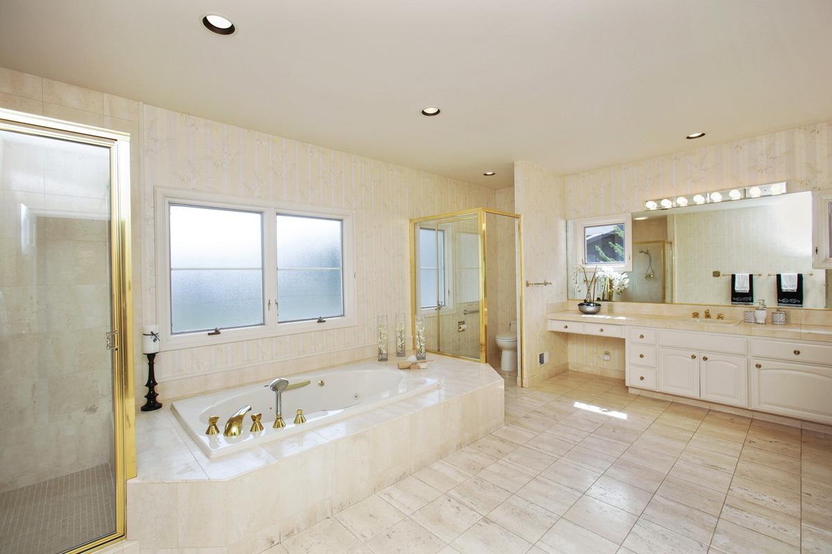 Stonepine Road Hillsborough, CA 94010 - Photo 16 of 25 a large spacious bathroom with a granite countertop tub sink and mirror
