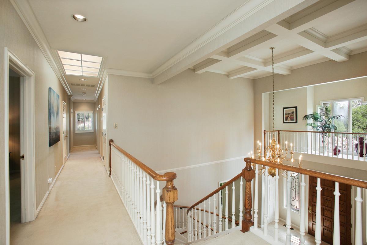 Stonepine Road Hillsborough, CA 94010 - Photo 20 of 25 a view of a hallway with wooden floor and windows
