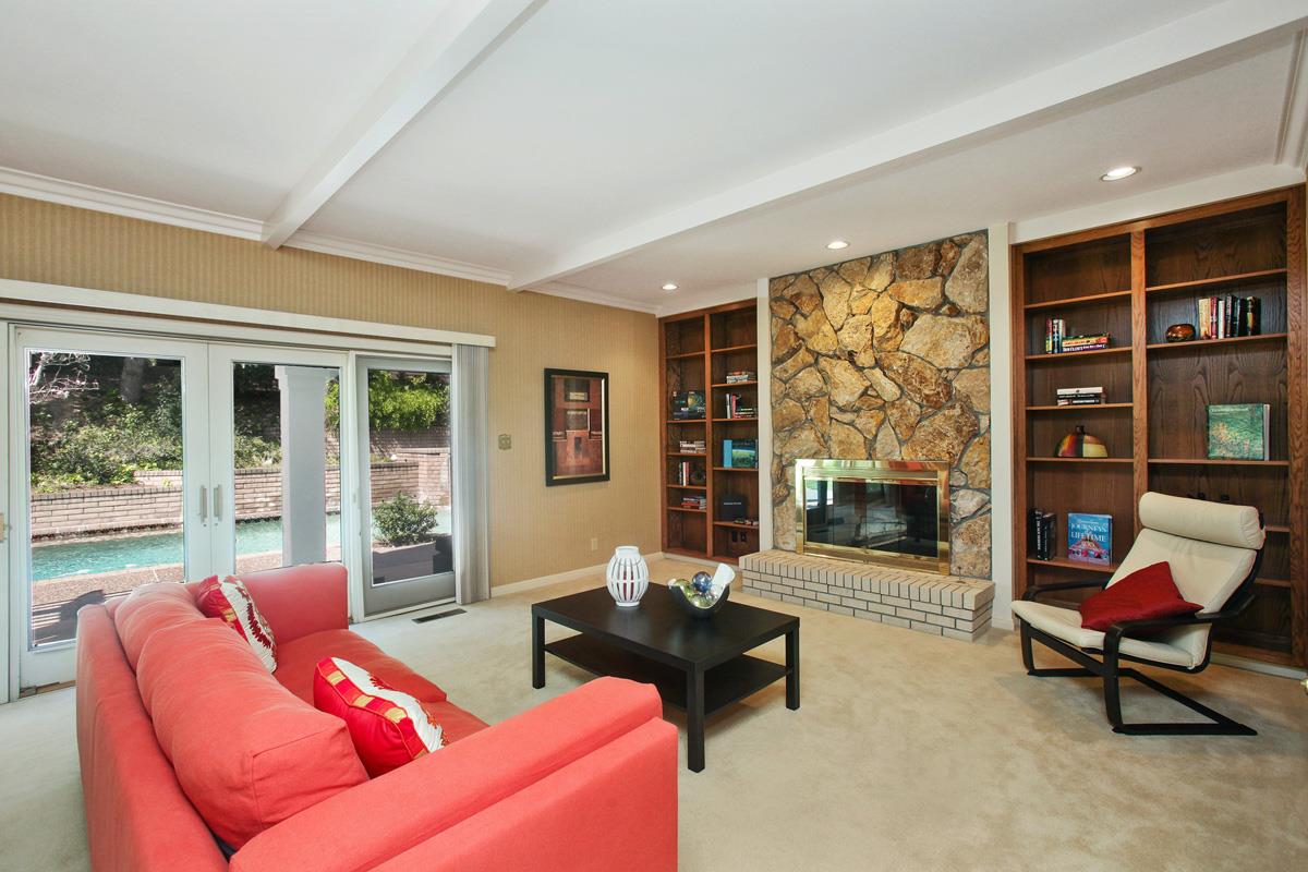 Stonepine Road Hillsborough, CA 94010 - Photo 9 of 25 a living room with furniture and a fireplace
