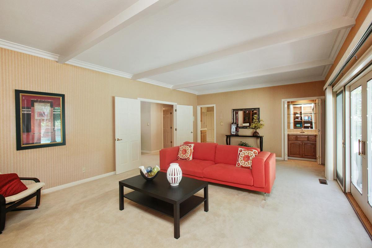 Stonepine Road Hillsborough, CA 94010 - Photo 10 of 25 a living room with furniture and a book shelf