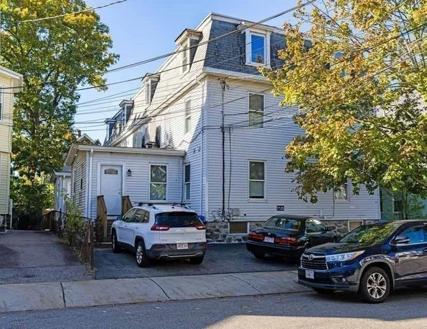 a car parked in front of a house