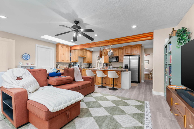 1489 North 400 West Bountiful, UT 84010 - Photo 13 of 47 Open-concept living area featuring light wood-finish flooring, a contemporary ceiling fan, and recessed lighting