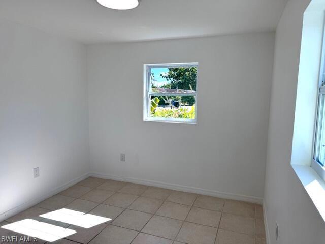 585 14th Street North Naples, FL 34102 - Photo 12 of 24 an empty room with a window