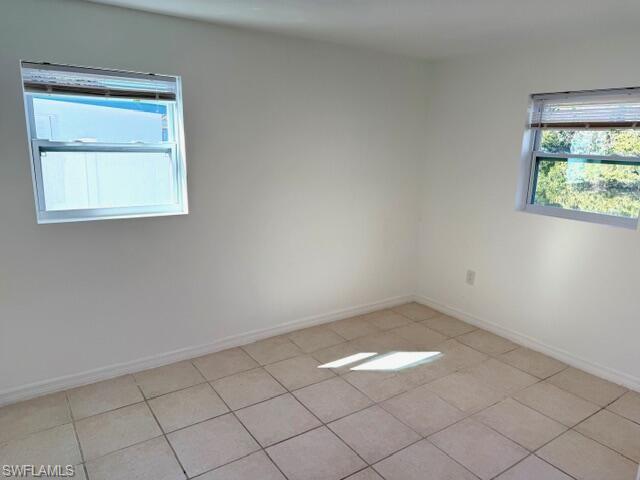 585 14th Street North Naples, FL 34102 - Photo 13 of 24 an empty room with a window