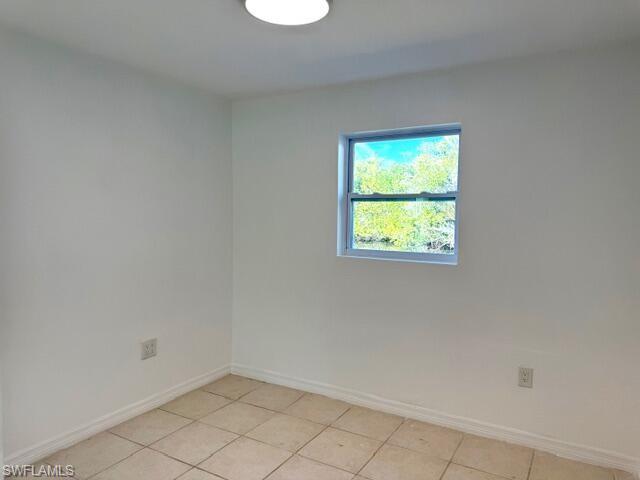 585 14th Street North Naples, FL 34102 - Photo 14 of 24 a view of an empty room with a window