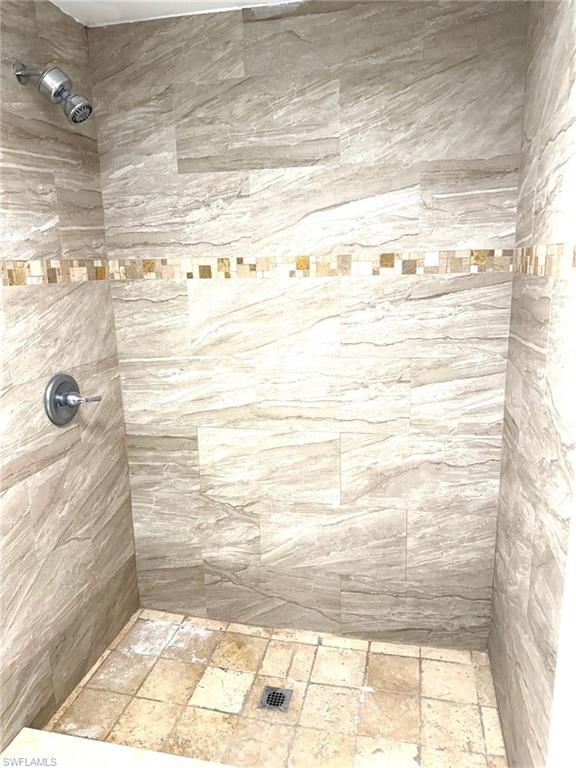 585 14th Street North Naples, FL 34102 - Photo 17 of 24 a bathroom with a shower