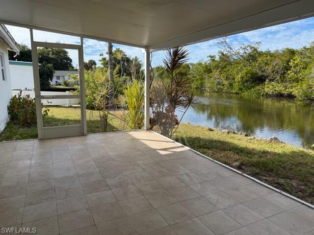 585 14th Street North Naples, FL 34102 - Photo 19 of 24 a view of a backyard with garden