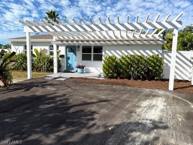 585 14th Street North Naples, FL 34102 - Photo 3 of 24 a view of a house with a outdoor space