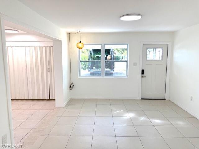 585 14th Street North Naples, FL 34102 - Photo 4 of 24 a view of an empty room with a window
