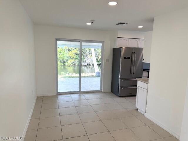 585 14th Street North Naples, FL 34102 - Photo 7 of 24 a view of kitchen with refrigerator and window