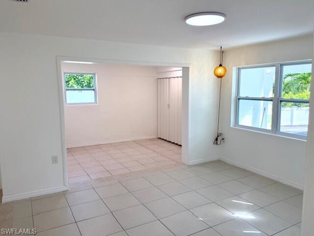 585 14th Street North Naples, FL 34102 - Photo 9 of 24 an empty room that has a window