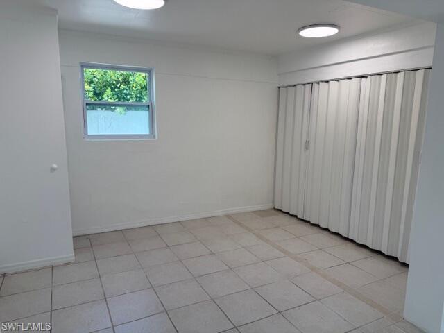 585 14th Street North Naples, FL 34102 - Photo 10 of 24 an empty room with windows