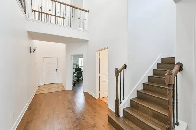 a view of an entryway with wooden floor