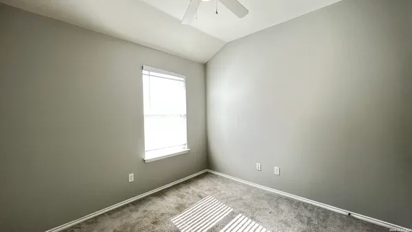 a view of an empty room and window