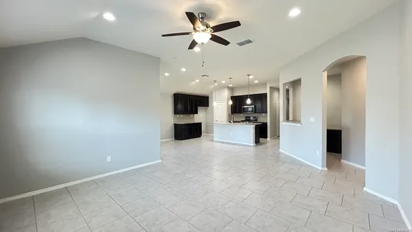 a view of a kitchen with a sink and a stove top oven