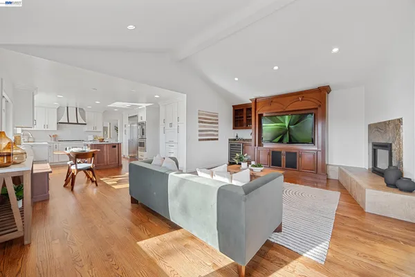 a dining room with furniture and a floor to ceiling window