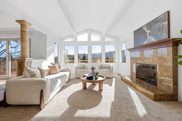 a bedroom with a bed and a large mirror on dresser