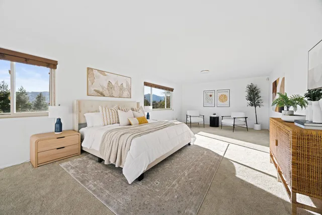 a bathroom with a granite countertop sink a toilet and mirror