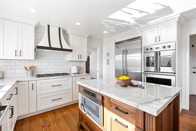 a living room with fireplace furniture and a flat screen tv