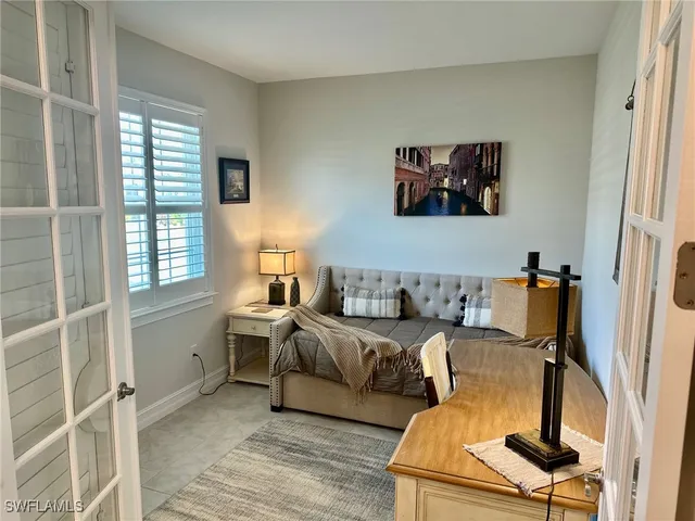 a bed room with a bed and a window