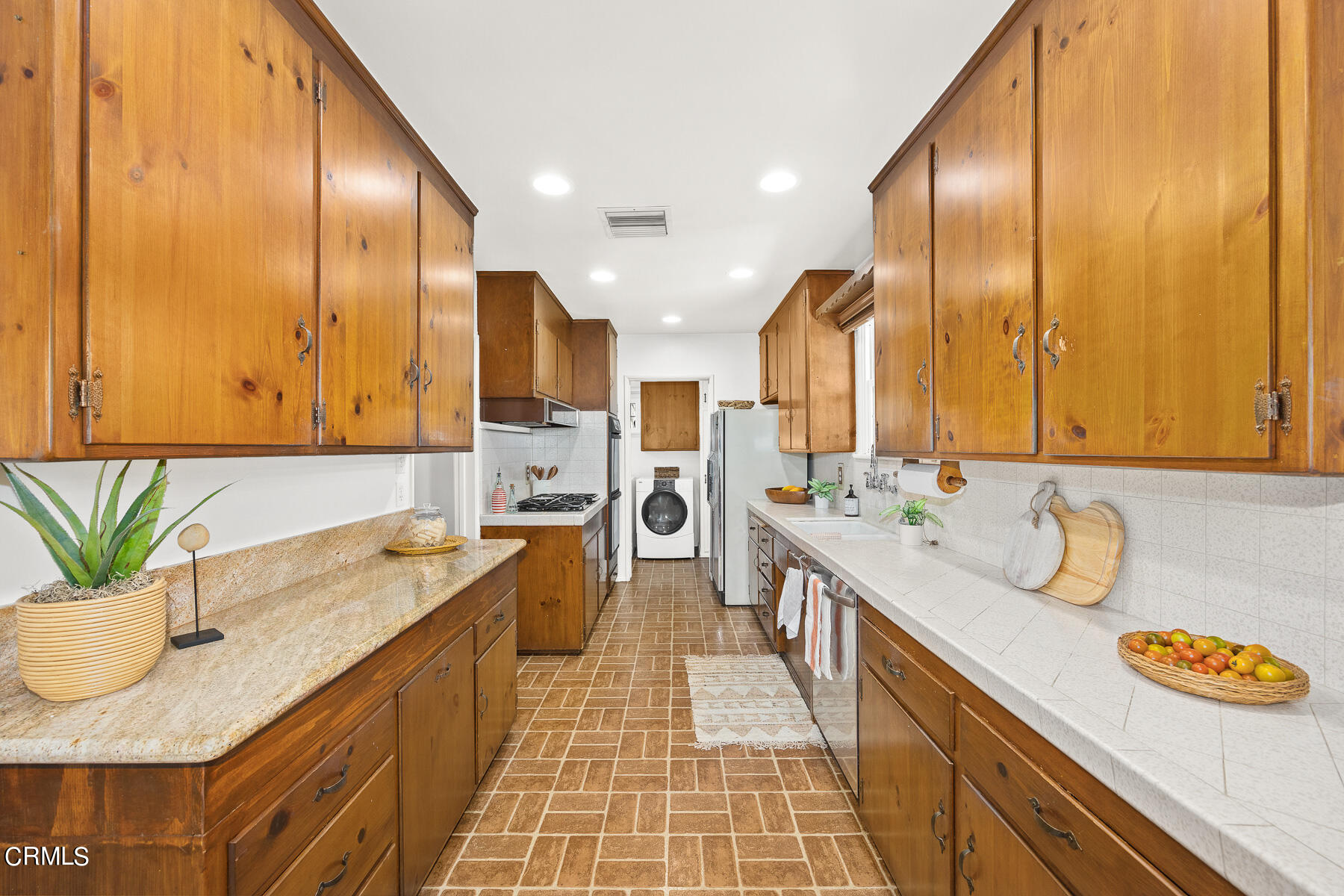 632 Brown Drive Burbank, CA 91504 - Photo 12 of 49 a bathroom with a granite countertop sink and a large mirror