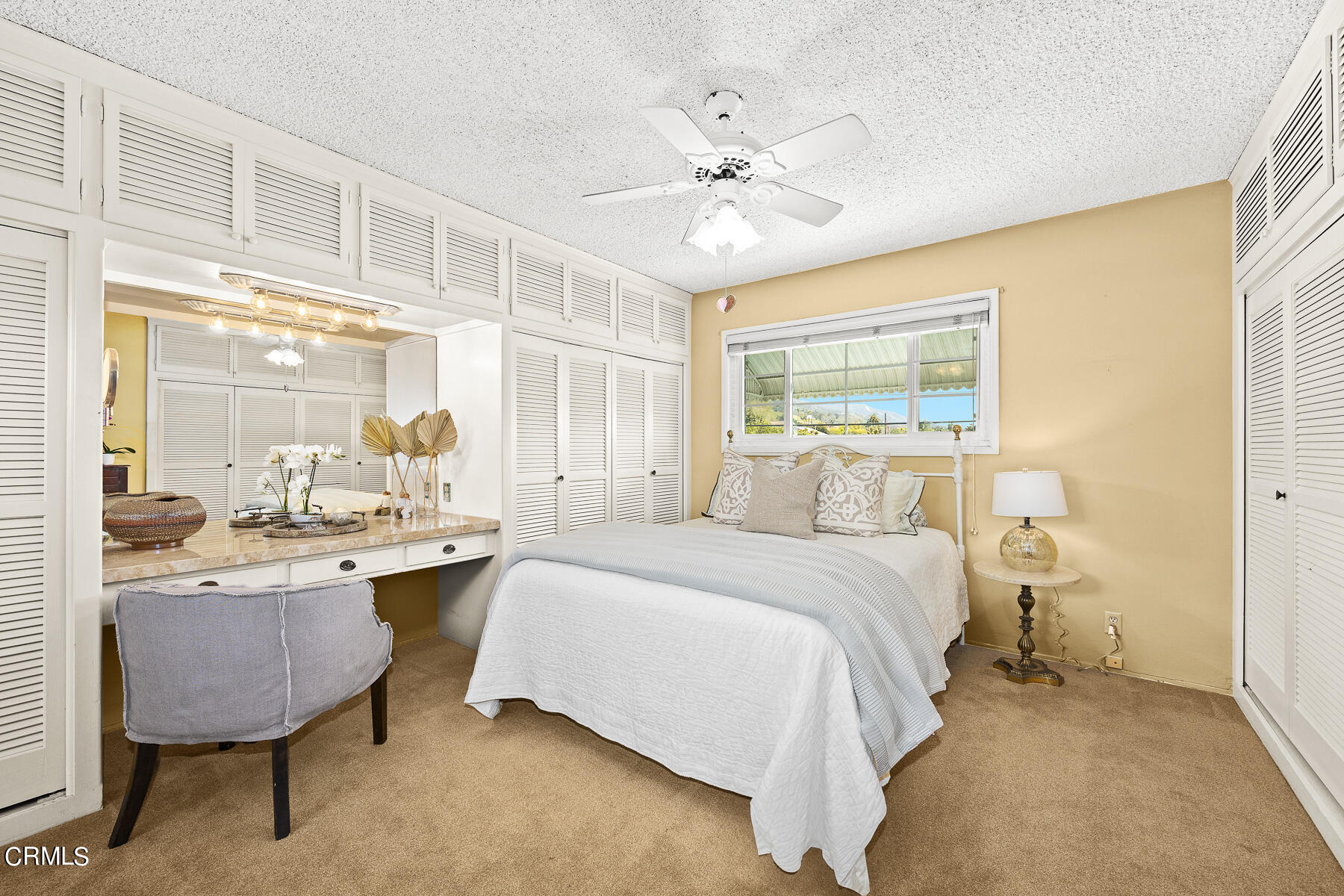 632 Brown Drive Burbank, CA 91504 - Photo 23 of 49 a spacious bedroom with a bed a chandelier and a window