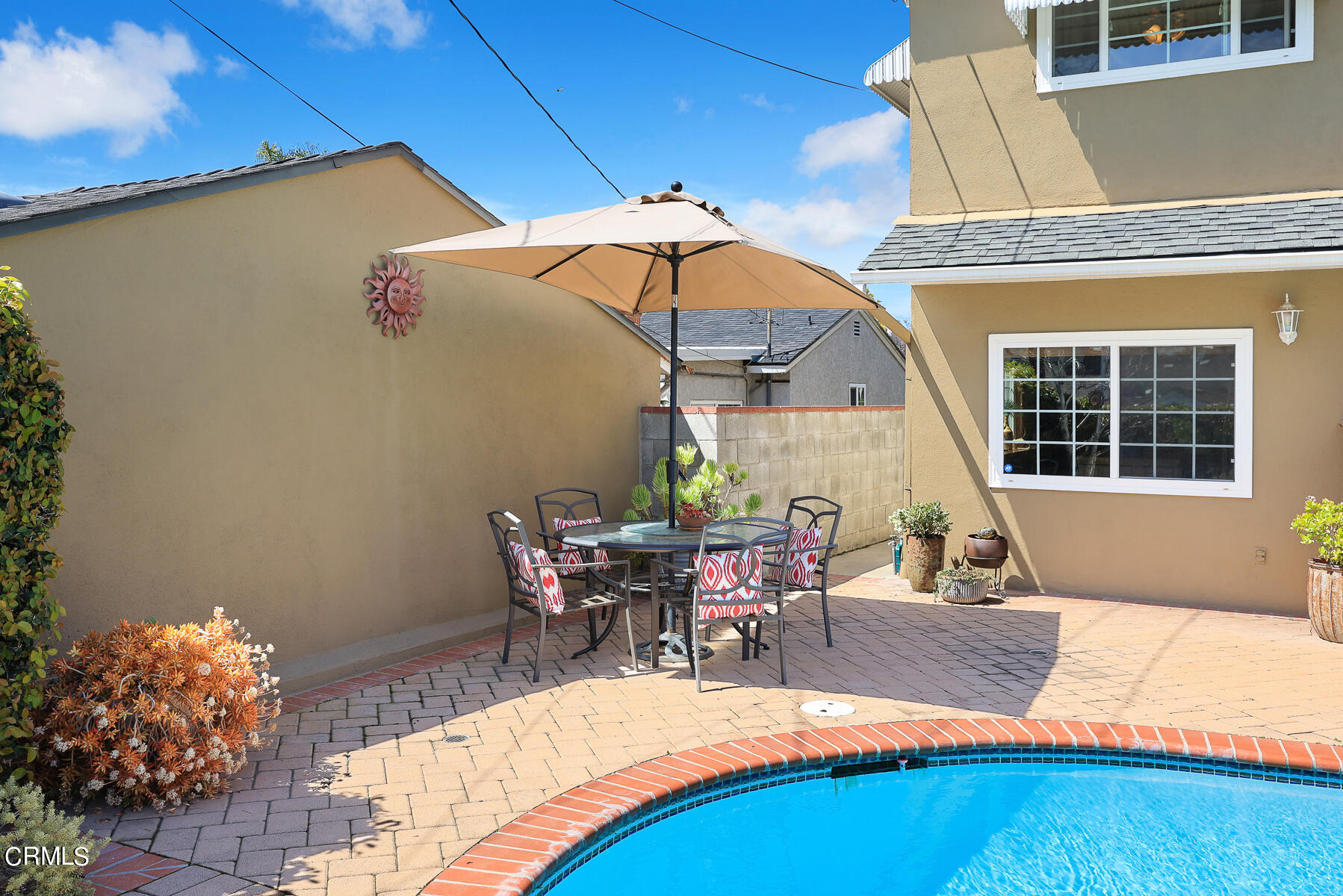 632 Brown Drive Burbank, CA 91504 - Photo 30 of 49 a view of a patio with table and chairs under an umbrella