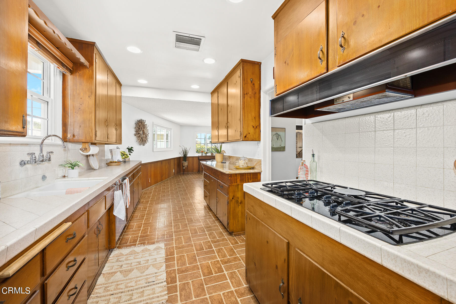 632 Brown Drive Burbank, CA 91504 - Photo 10 of 49 a large kitchen with stainless steel appliances granite countertop a lot of counter space and a sink