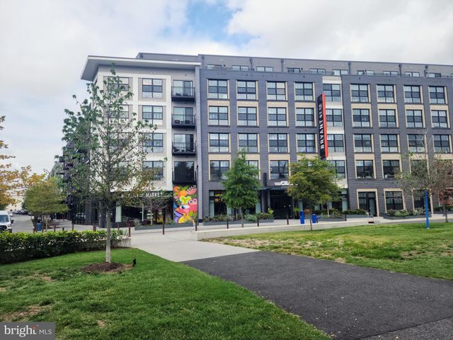 a view of a building with a bench in front of building