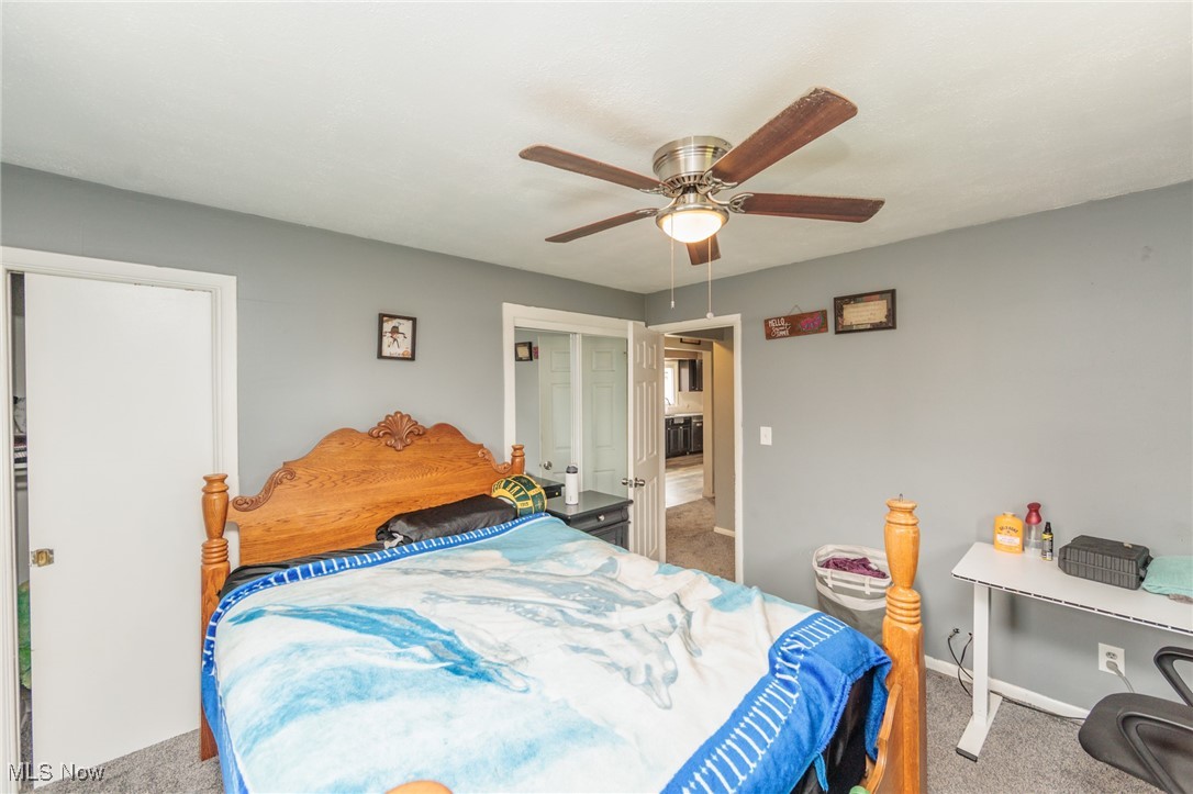 3443 Dentzler Road Parma, OH 44134 - Photo 15 of 48 Bedroom featuring baseboards, ceiling fan, a closet, and carpet floors