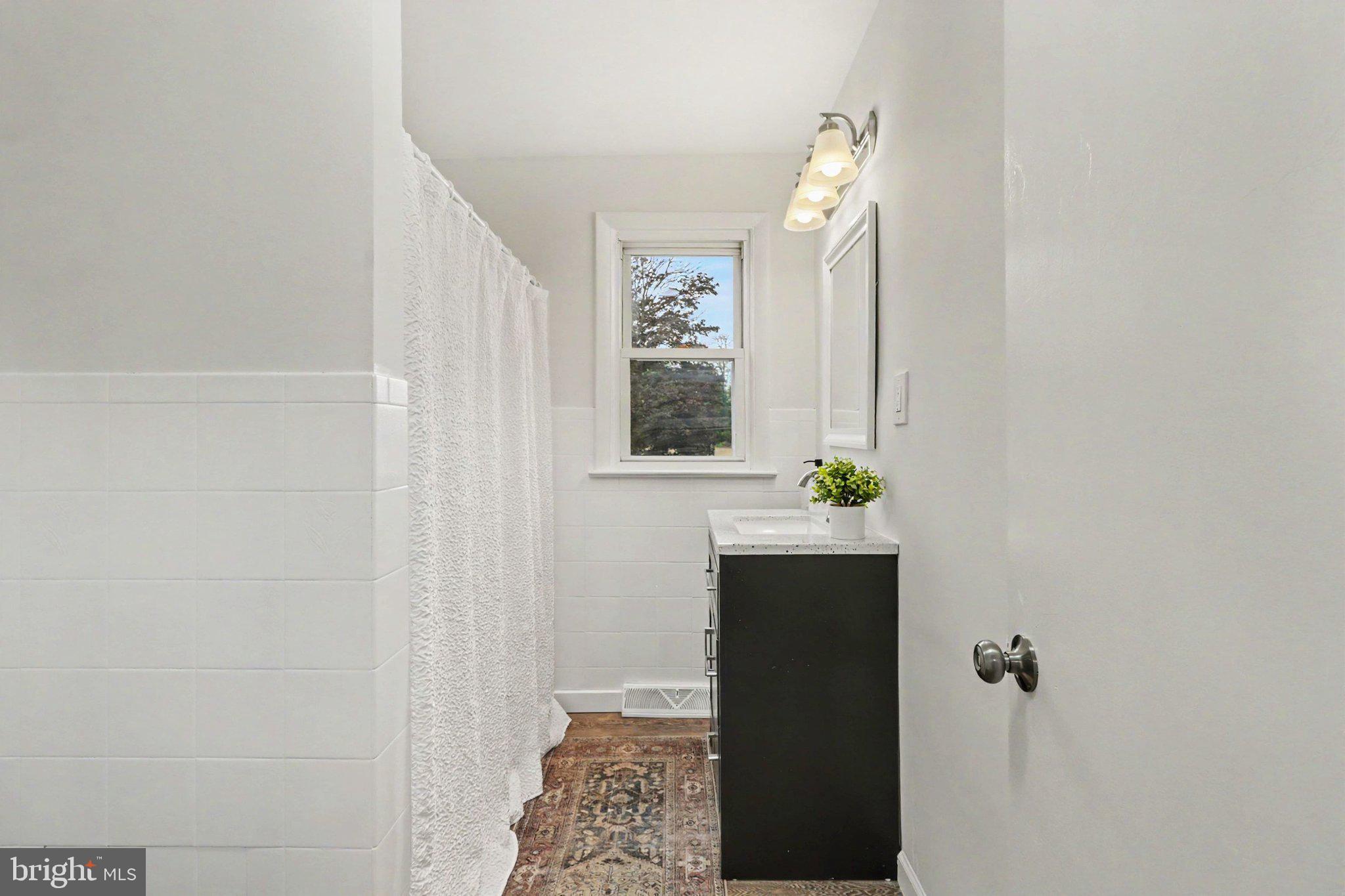 708 Baltimore Road Shippensburg, PA 17257 - Photo 15 of 24 a bathroom with a sink and a mirror