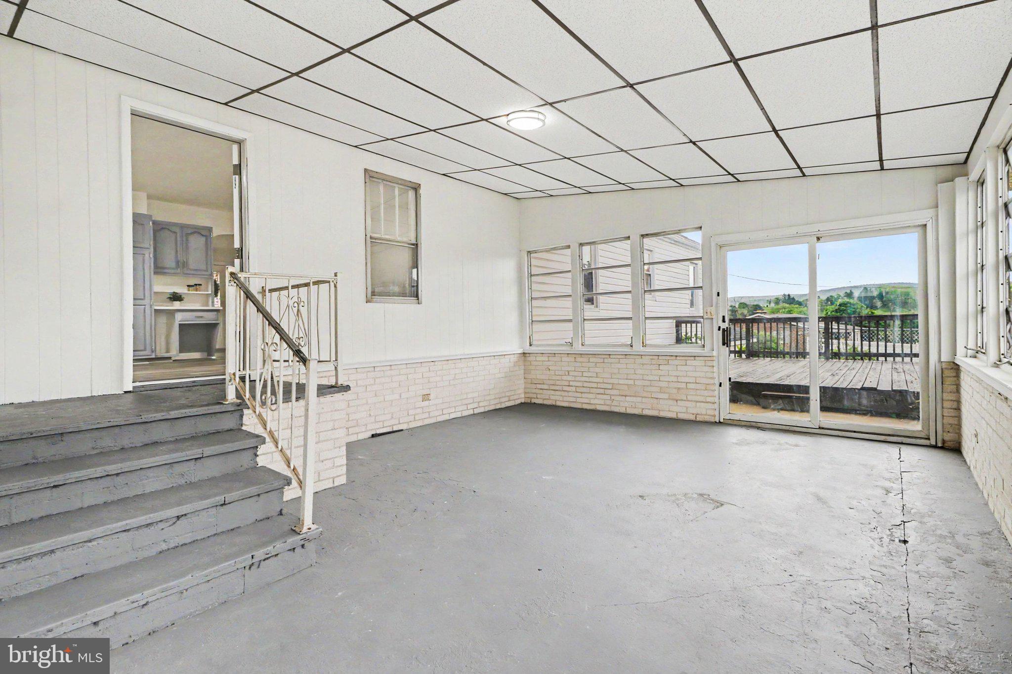 708 Baltimore Road Shippensburg, PA 17257 - Photo 19 of 24 a view of an empty room with a staircase