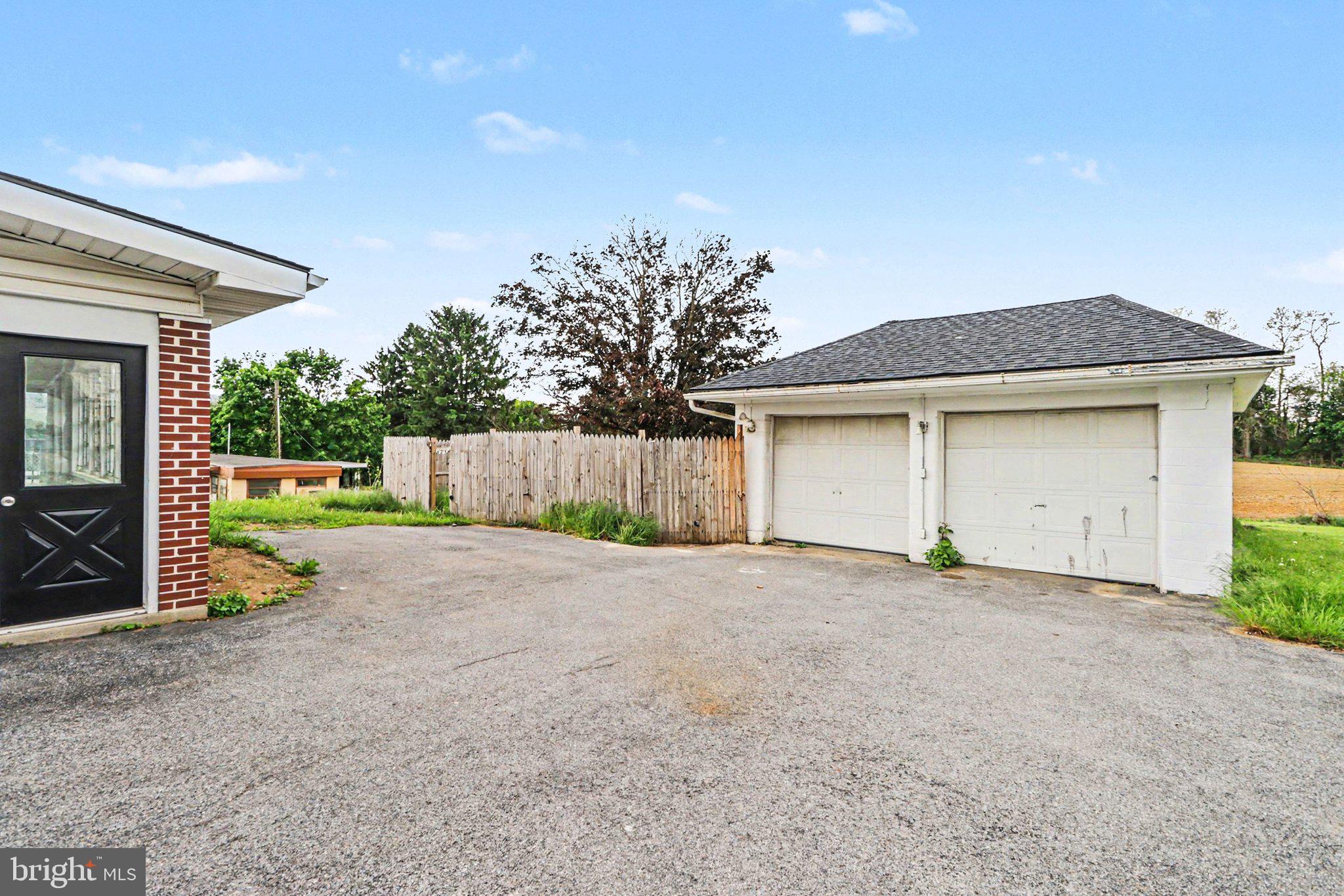 708 Baltimore Road Shippensburg, PA 17257 - Photo 21 of 24 a view of a house with a yard and garage