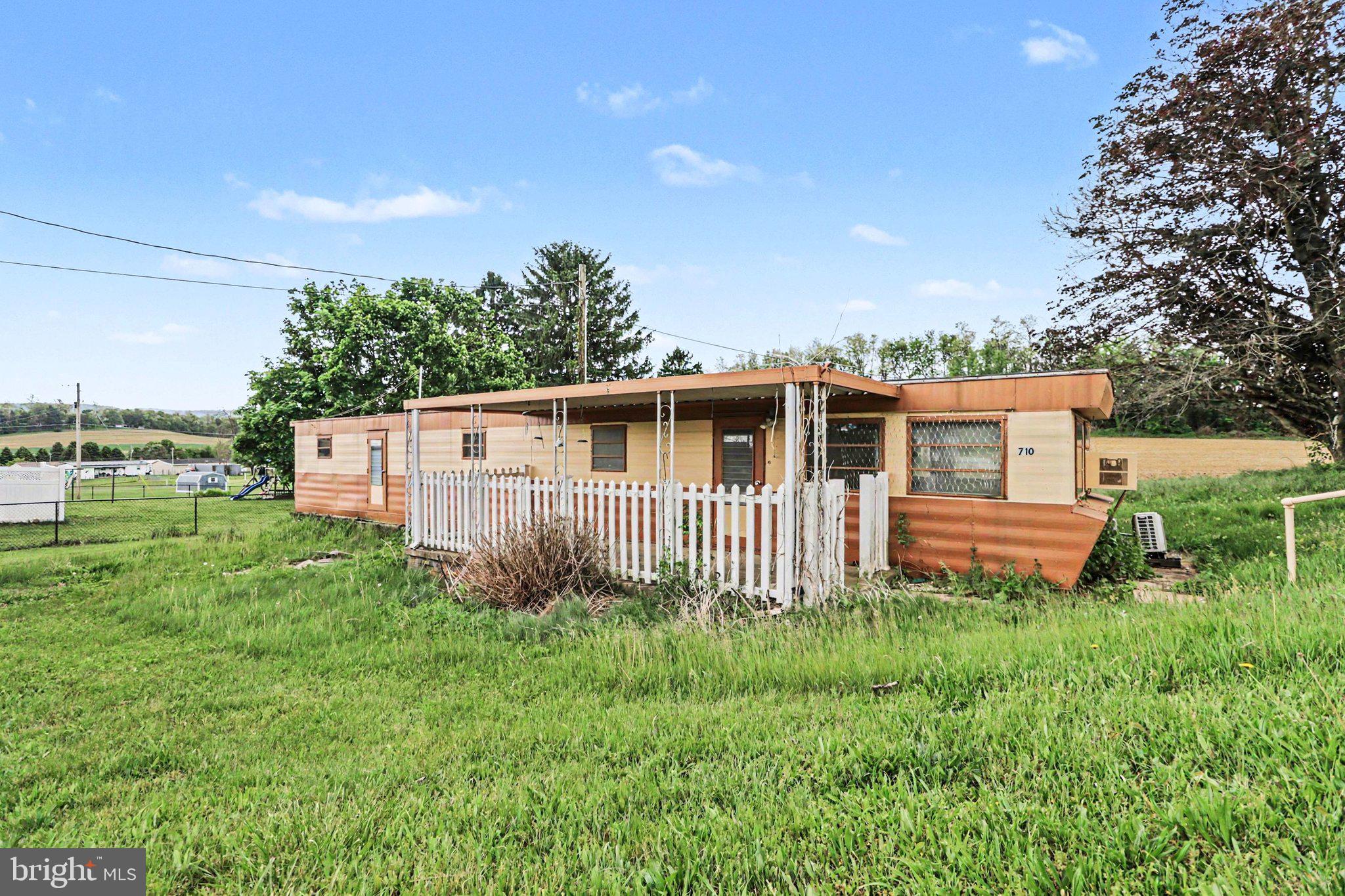 708 Baltimore Road Shippensburg, PA 17257 - Photo 23 of 24 a front view of a house with backyard