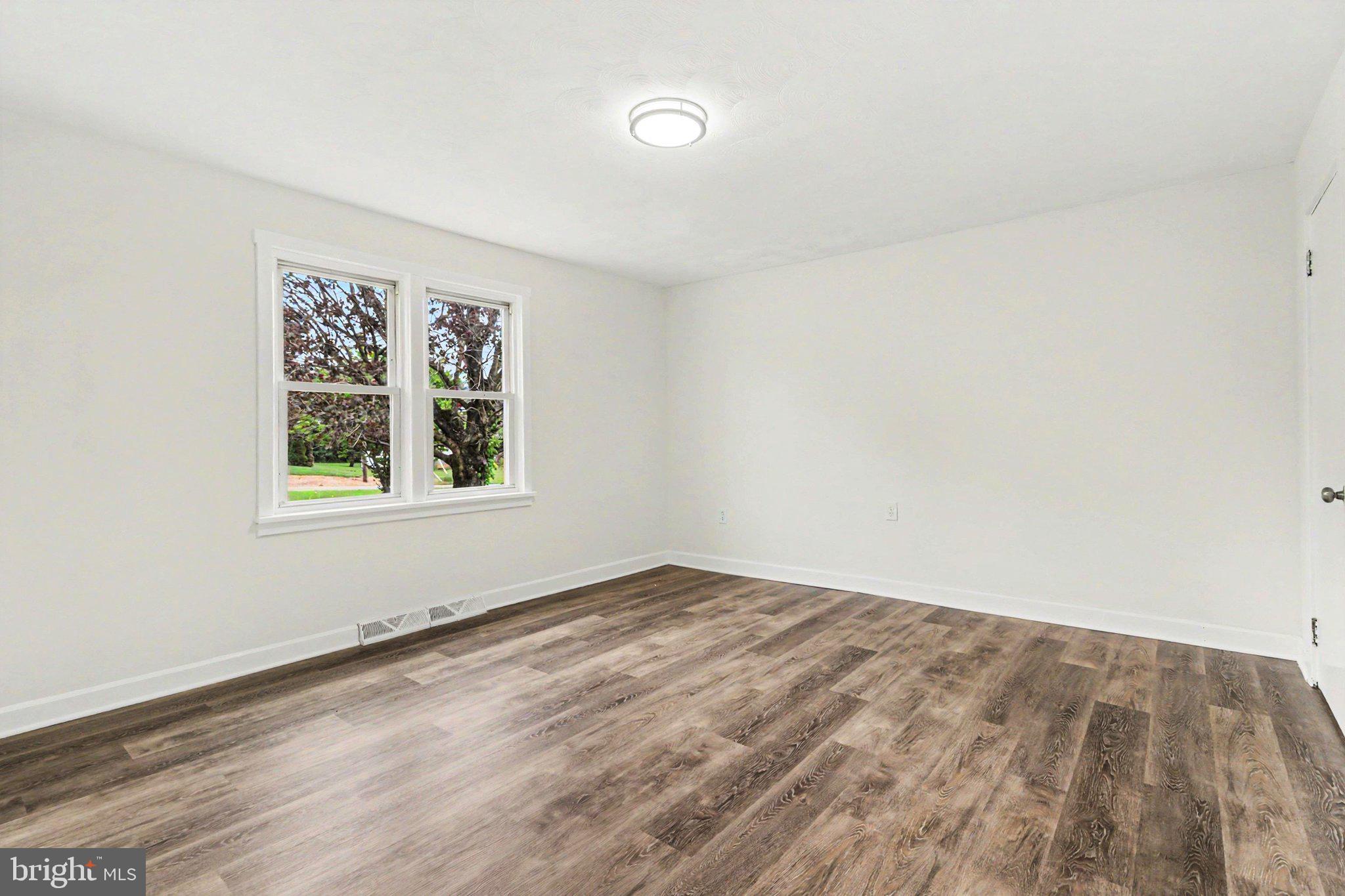 708 Baltimore Road Shippensburg, PA 17257 - Photo 7 of 24 an empty room with windows