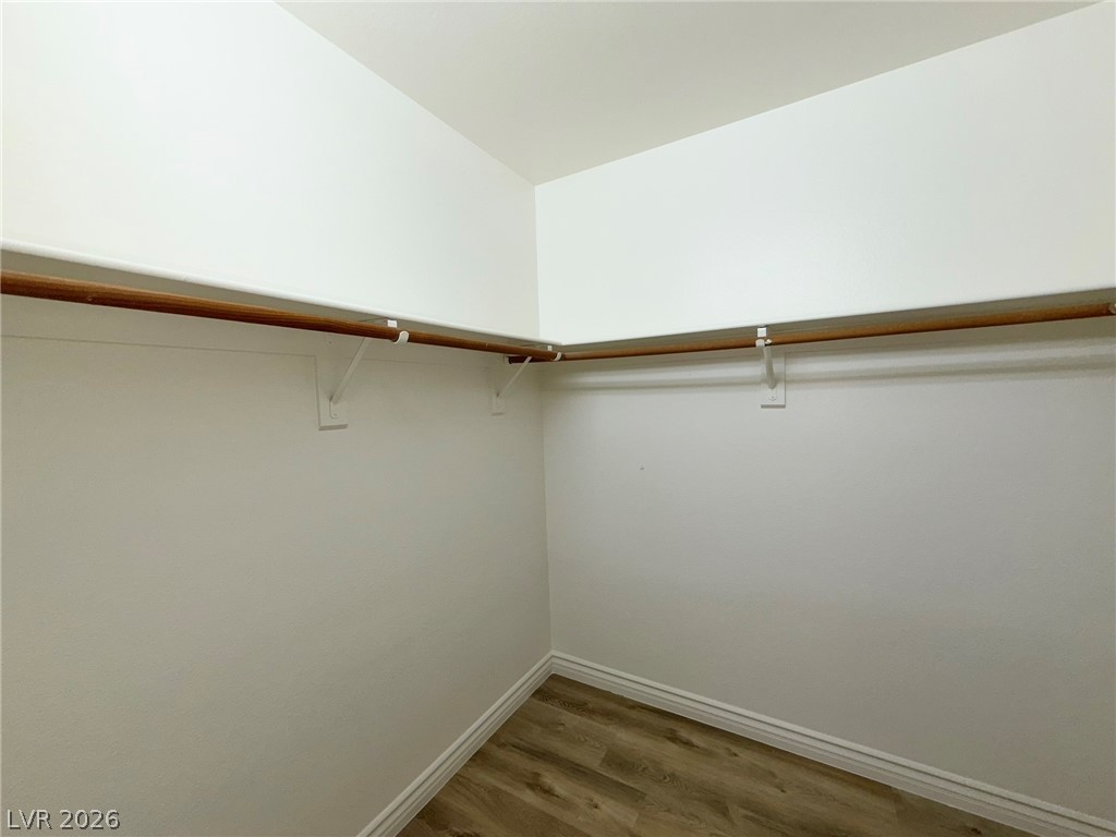 9729 Trail Rider Drive Las Vegas, NV 89117 - Photo 17 of 26 Ample hanging space and durable flooring define this well-appointed walk-in closet.